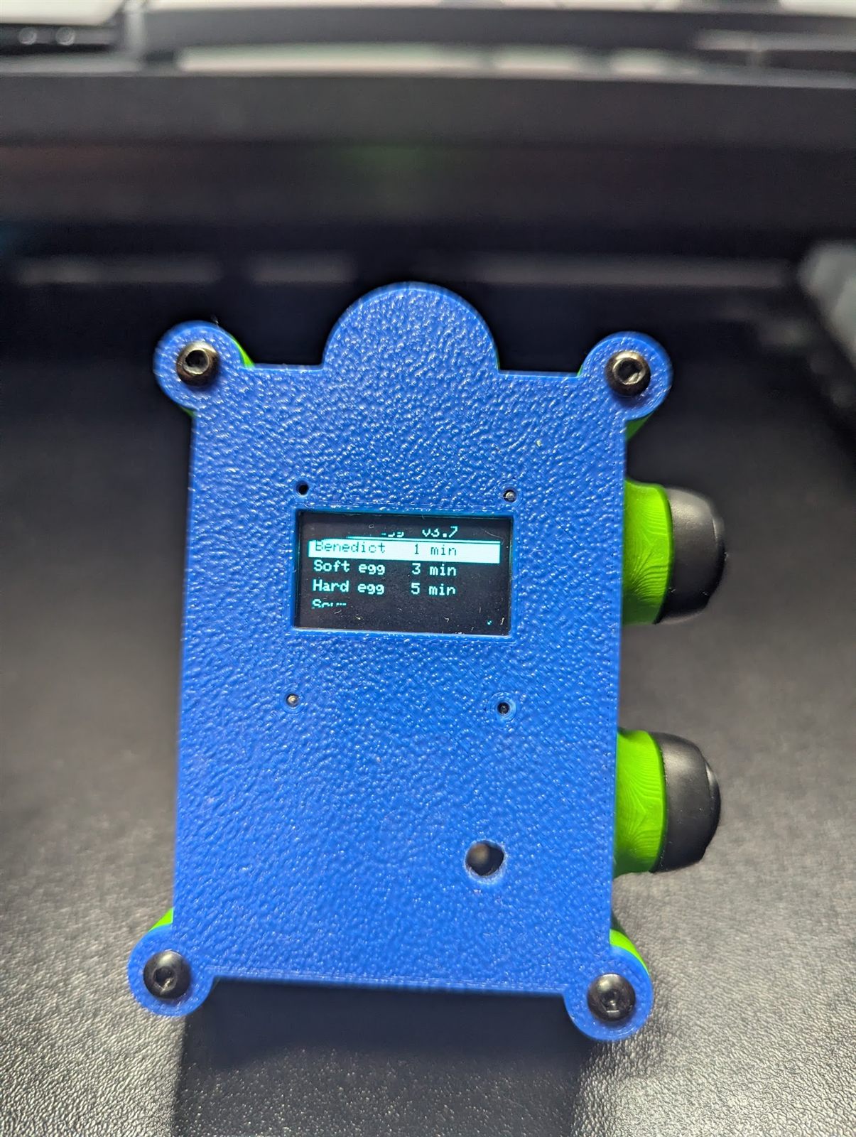 Front view of PotWatch: the OLED screen showing the Benedict, soft egg and hard egg presets
