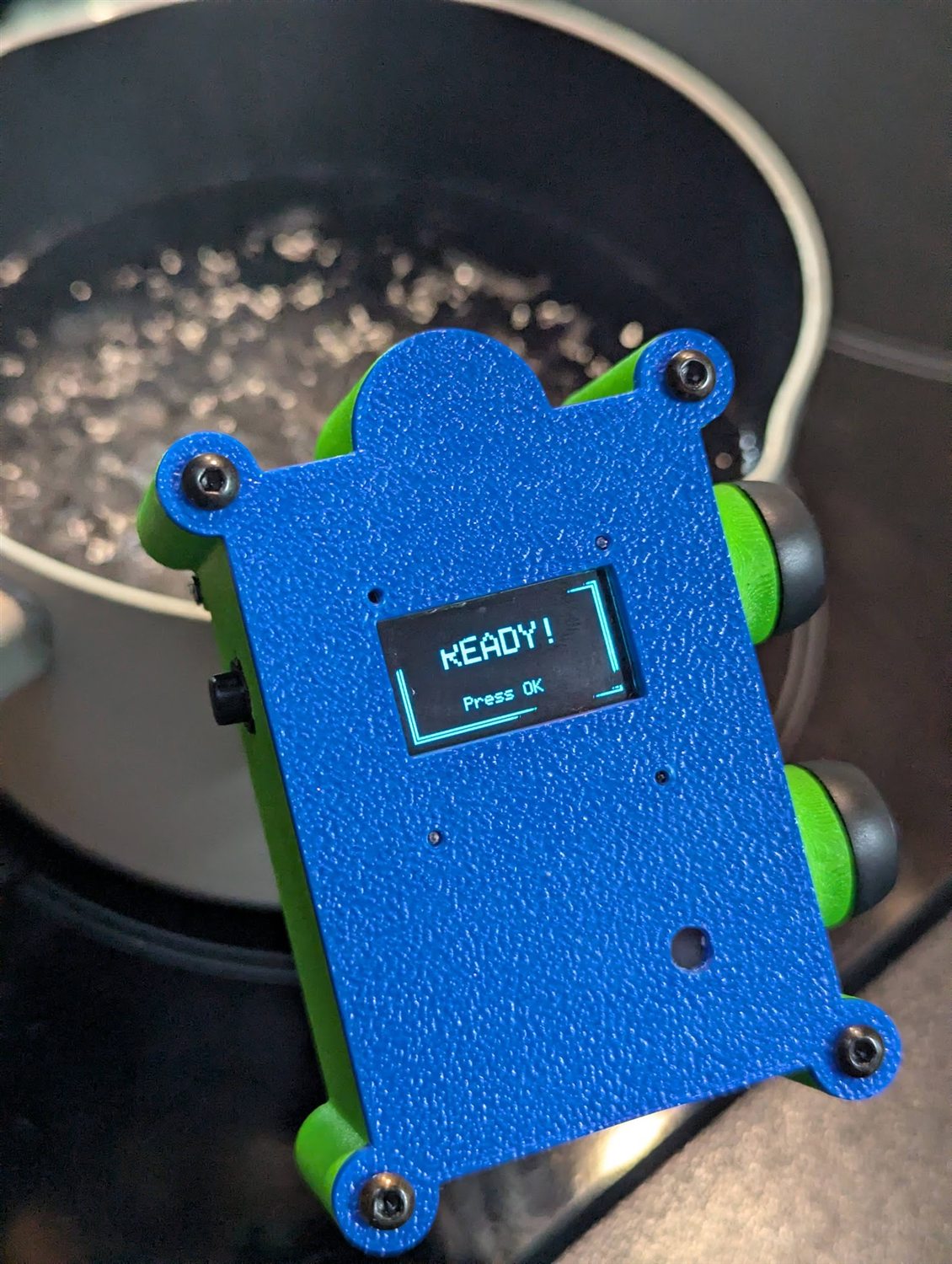 The device showing READY! and Press OK beside the boiling pot